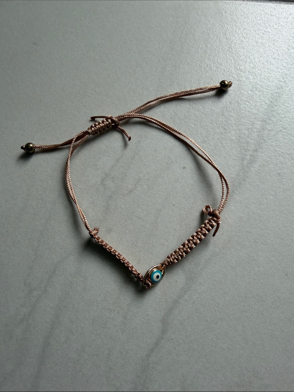 Adjustable Rose Gold Cord Bracelet with Blue Evil Eye